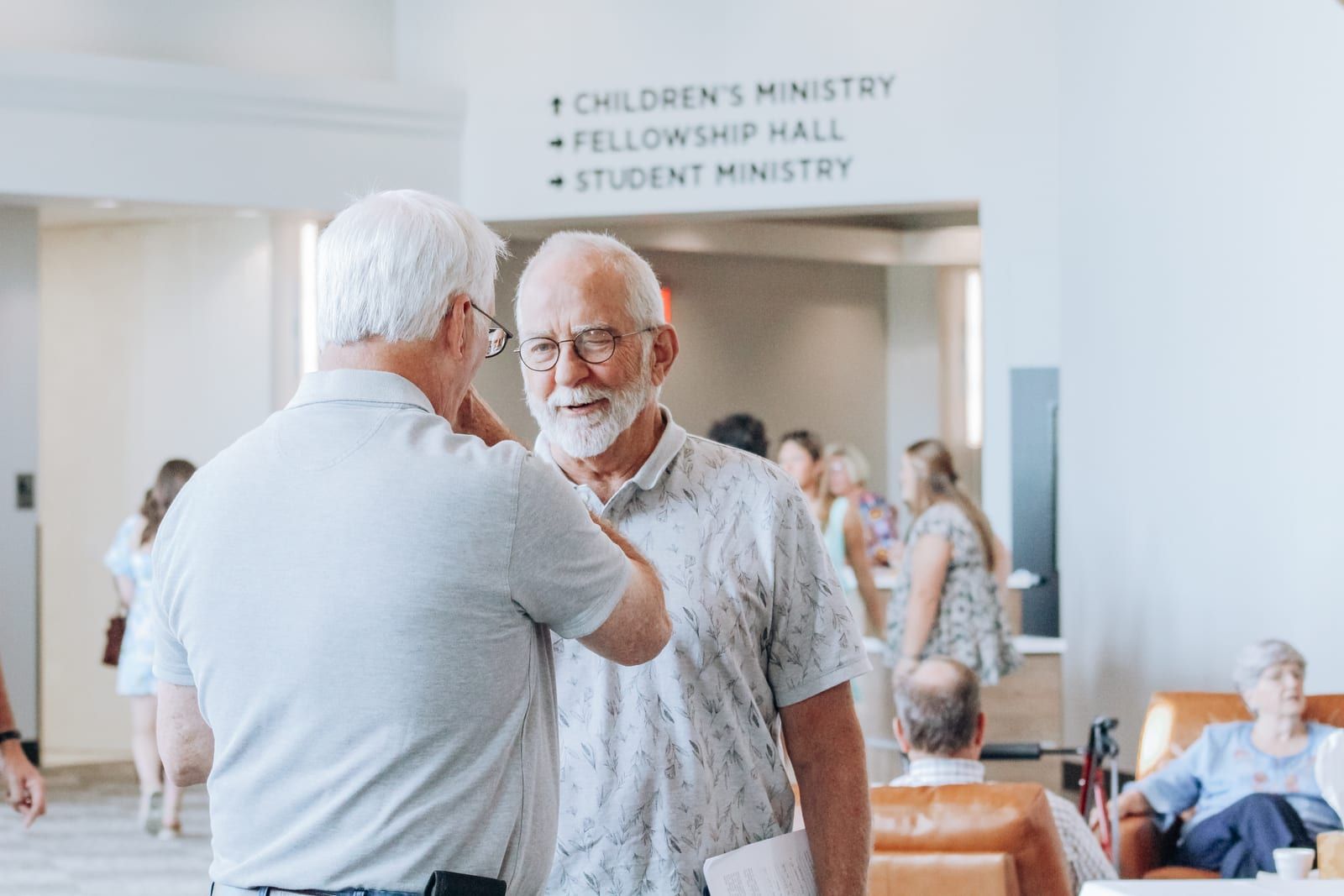 People talking in the lobby after the service