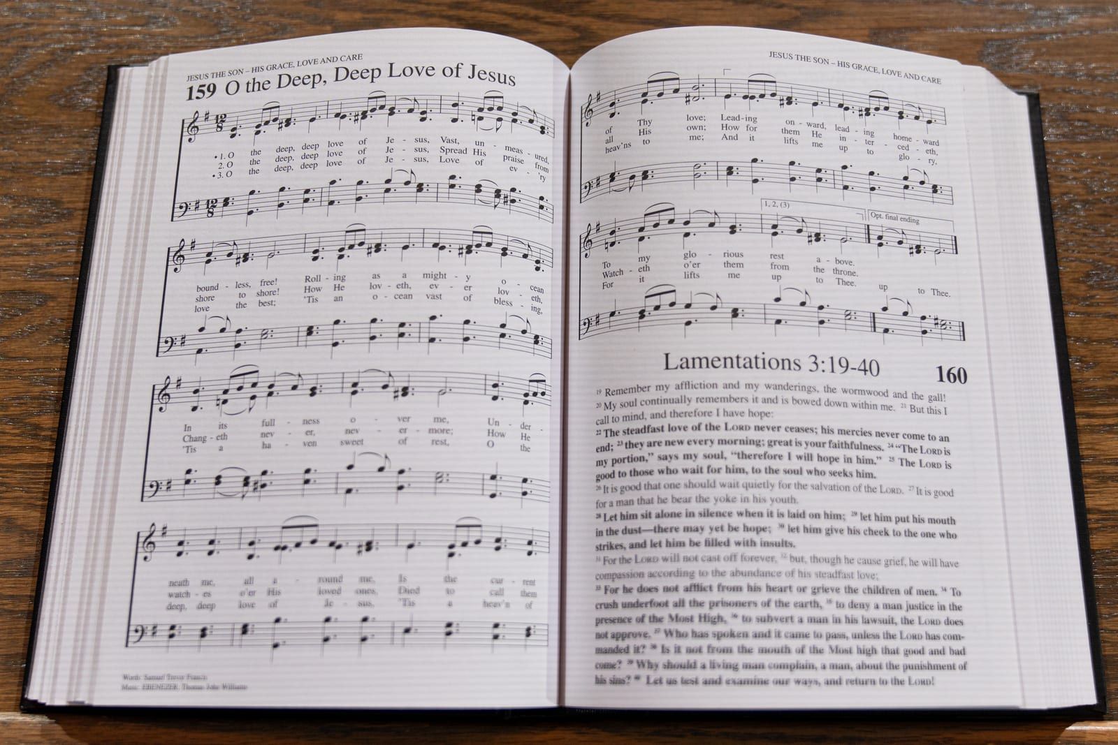 An open hymnal turned to “O the Deep, Deep Love of Jesus.”
