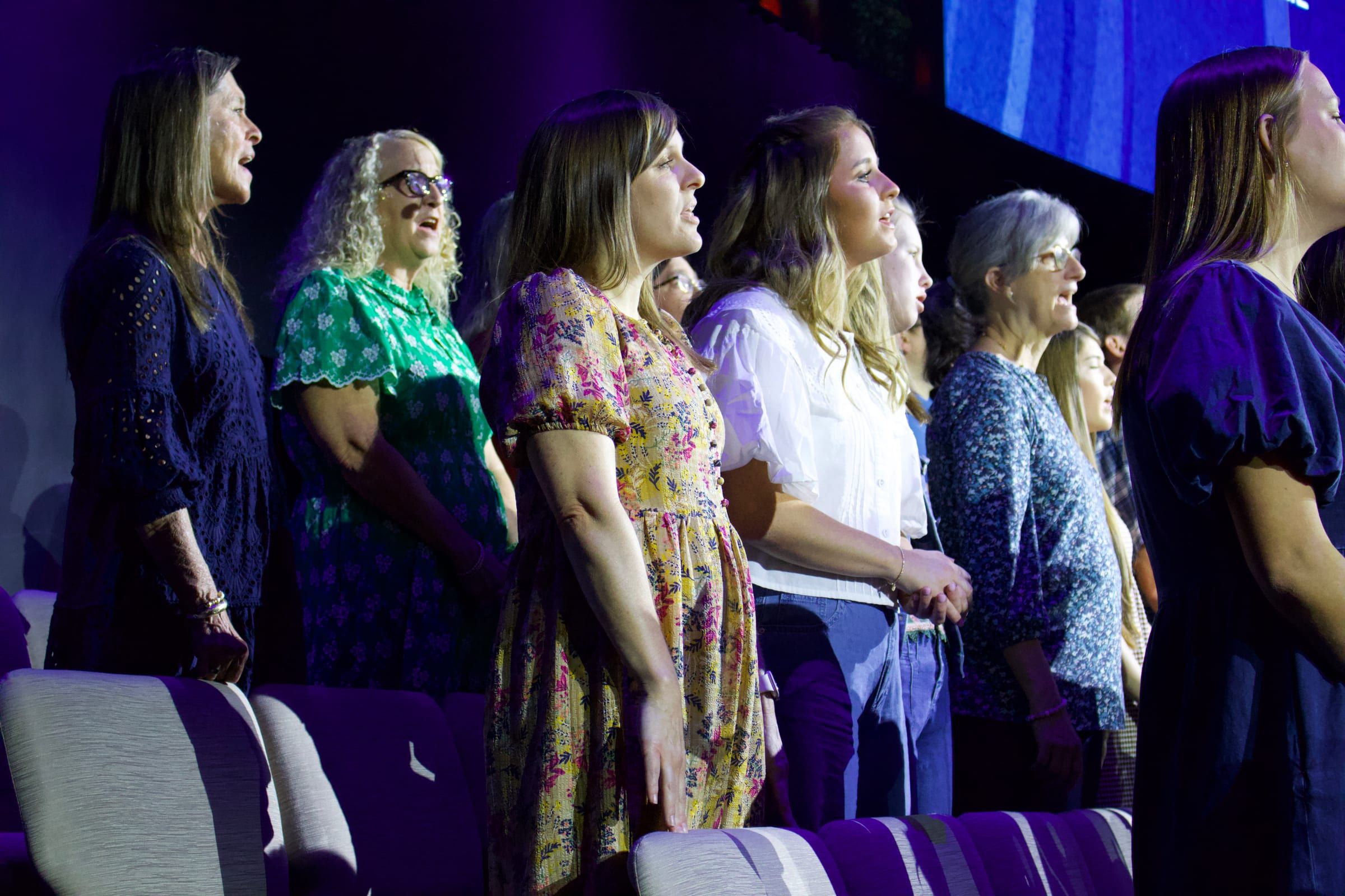 Choir members singing together during a Sunday service.